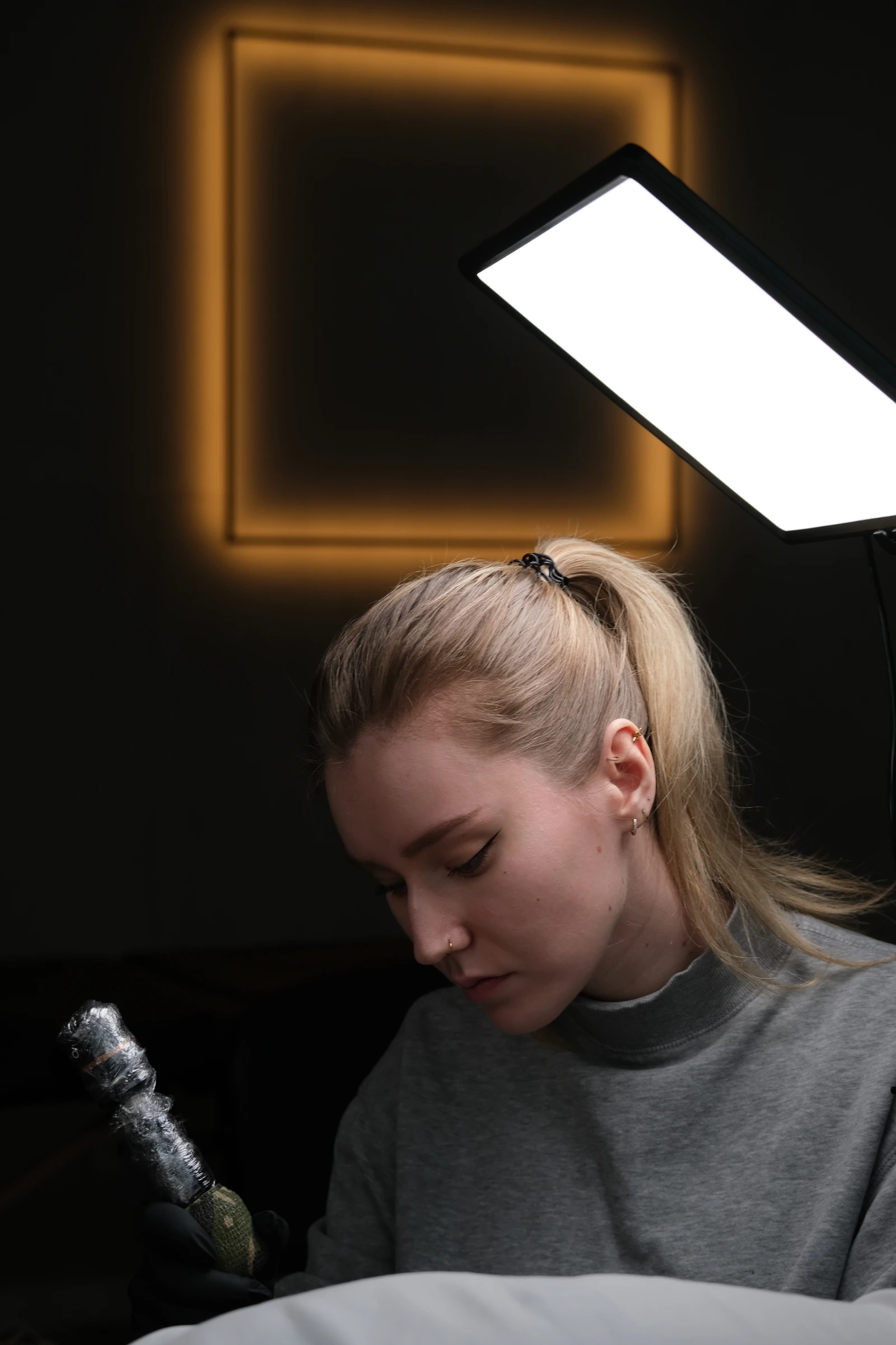 Laura tattooing in the studio